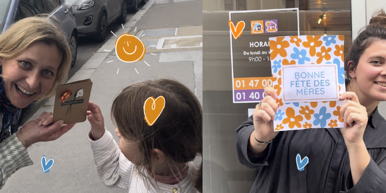 img-de-meresetfilles-qui-sourient-tenant-unecarte-pour-la-fêtedesméres2024